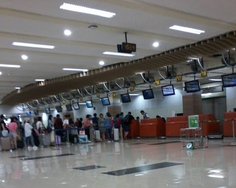 Waiting to check in at the GARUDA counter.